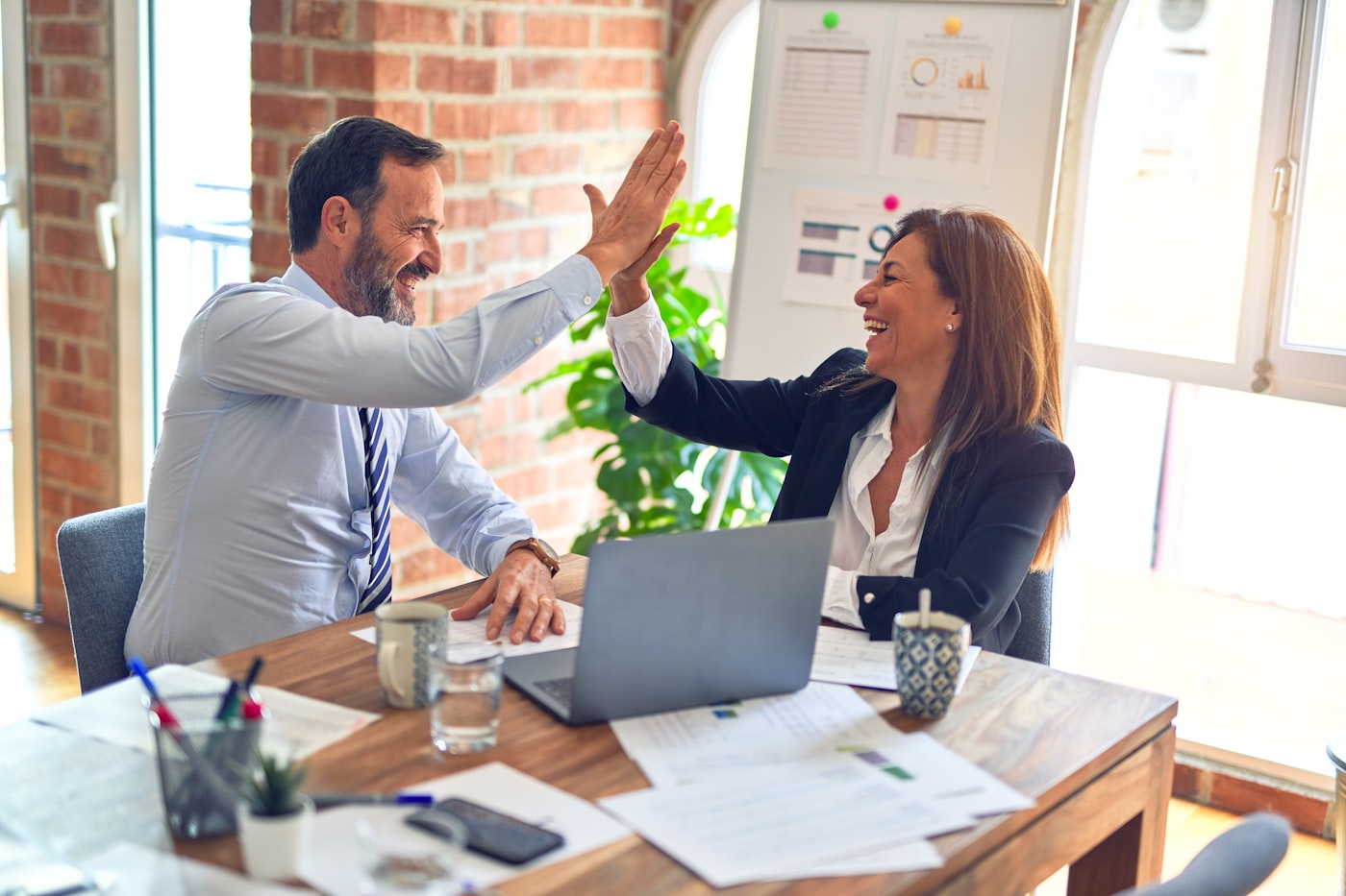 Insurance professionals reviewing a successful campaign
